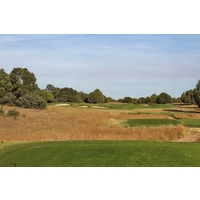 The afternoon sun lights up the par-3 16th hole at Talking Rock Golf Club in Prescott, Arizona.